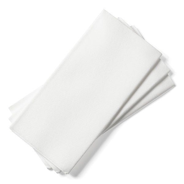 Folded white dinner napkins